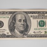 a one hundred dollar bill with a picture of a man's face on it