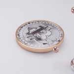 a coin sitting on top of a white surface