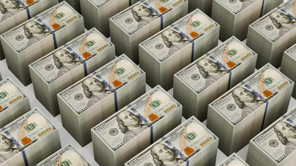 Stacks of $100 bills are neatly arranged.